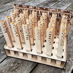 a bunch of wooden trophies sitting on top of a wooden table next to each other