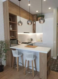 a kitchen with white counter tops and stools