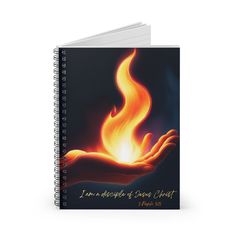 a spiral notebook with the words i am enough of those christ written in flames on it