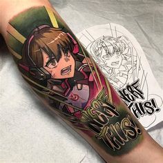 an anime character tattoo on the arm