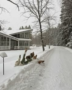 a person laying in the snow with their feet up