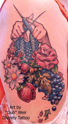 a woman with a tattoo on her back holding a knife and some fruit in front of her