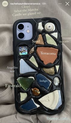 an iphone case that has many different things in it, including sea shells and seashells