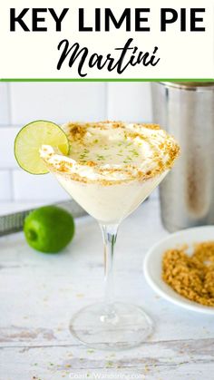 the key lime pie martini is garnished with whipped cream, lime and sugar