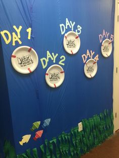 a wall with plates on it that say days 1, 2, 3 and 5