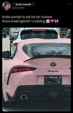 the back end of a pink sports car