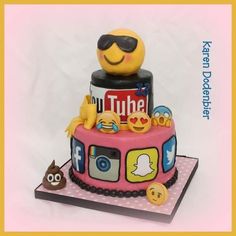 a birthday cake decorated like a bus with emoticions on it