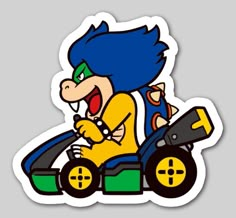 the mario kart sticker is shown on a gray background with an orange and blue car