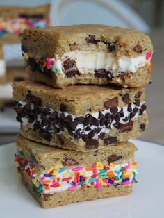 three dessert bars stacked on top of each other with sprinkles and chocolate chips