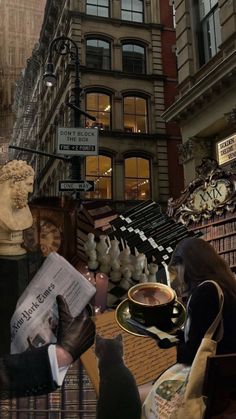 a woman sitting at a table with a cup of coffee in front of bookshelves