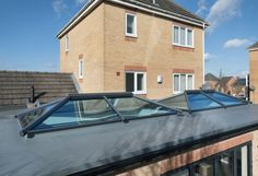 an image of a house with a skylight on the roof and some windows in it