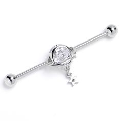 Product Details14 Gauge Clear Gem Starry Saturn Dangle Industrial Barbell 38mm This 14 gauge helix barbell is out of this world. It is made with a 1 1/2 inch 316L surgical grade stainless steel straight barbell with 5mm ball ends. It features the planet Saturn, with the planet composed of a single clear gem and ring. Beneath the planet dangles a small star charm, set with a clear gem for an added touch of style and you can even slide it up and down the length of the barbell for the perfect look. Star Industrial Piercing, Industrial Piercing Jewelry Spirit Adornments Piercing Jewlery, Silver Stainless Steel Curved Barbell Jewelry, Opal Industrial Piercing, Heart Shaped Industrial Piercing, Industrial Piercing Jewelry Opal, Types Of Ear Piercings, Planet Saturn, Barbell Earrings