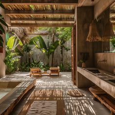 an outdoor bathroom with wooden benches and plants in the shower area, surrounded by palm trees