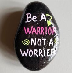 a painted rock that says be a warrior not a worrier