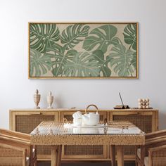 a dining room table and chairs in front of a wall with a painting on it