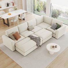 a living room with a large white sectional couch