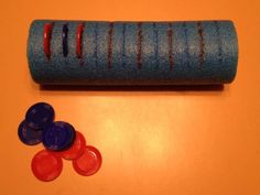 a roll of felt next to some red, white and blue buttons on a table