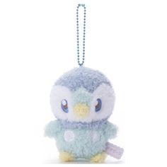 a blue and white stuffed animal hanging from a chain