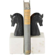 a bookend with two black horses on it's sides next to each other