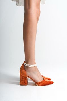 ORANGE VELVET SHOES, ORANGE WEDDING SHOES, ORANGE SHOES, ORANGE HIGH HEELS, ORANGE BLOCK HEELS, ORANGE BRIDAL SHOES, ORANGE HEELS As Eleanor Louise, we stand out with our Orange heeled shoes that combine style and comfort. Specifically designed for brides, these shoes are crafted with high-quality materials. * Made from Orange Velvet and Premium Vegan Leather, our shoes are equipped with an ankle strap that provides comfort throughout the day. * Completing your style and boosting your confidence is the most elegant way! Orange Velvet 3.15-inch (8 cm) high-heeled shoes offer elegance and chicness with every step. Whether it's for daily wear or a special event, these shoes not only add height but also provide a sophisticated touch to your style. * Their classic and elegant design perfectly c Orange Velvet Shoes, Orange Closed Toe Elegant Heels, Elegant Orange Closed Toe Heels, Elegant Orange Ankle Strap Heels, Elegant Orange Heels With Wrapped Heel, Orange Almond Toe Heels For Party, Party Orange Almond Toe Heels, Orange Low Heel Party Heels, Elegant Orange Block Heel Shoes