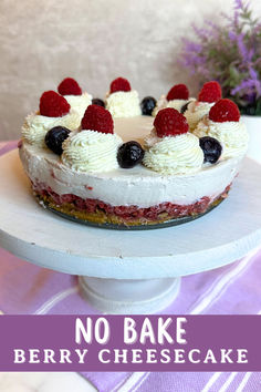 no bake berry cheesecake on a cake plate with the words, no bake berry cheesecake