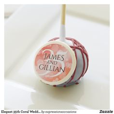 a candy bar with an orange and white striped lollipop on it's top