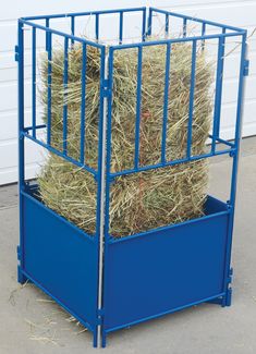 a blue metal container with hay in it