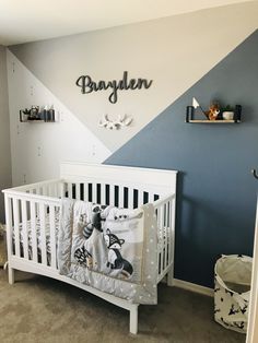 a baby's room with blue walls and white crib