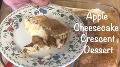 an apple cheesecake dessert on a plate with the words apple cheesecake crescent dessert