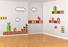 an empty room with mario bros wall decals on the walls and wood flooring