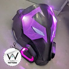 a purple helmet sitting on top of a table next to a pair of sci glasses