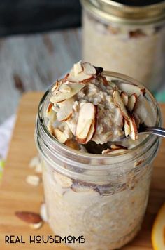 a jar filled with oatmeal sitting on top of a wooden cutting board