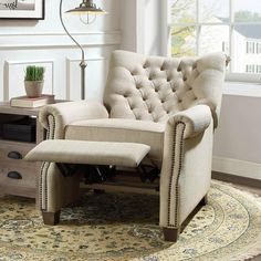 a living room with a chair and rug