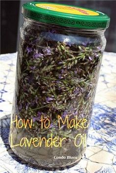 a jar filled with lavender flowers sitting on top of a table