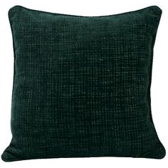 a dark green pillow on a white background