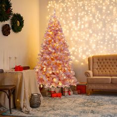 a pink christmas tree in a living room