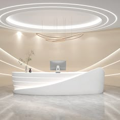 a white reception desk in an office with circular lights above it and a potted plant on the counter