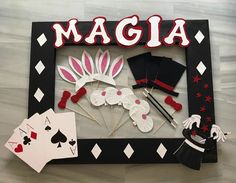 a photo frame that has some cards in front of it and the words magja on it