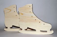 a pair of wooden skates sitting next to each other