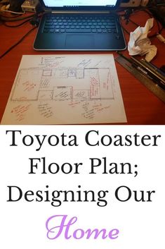 a laptop computer sitting on top of a desk next to a piece of paper with the words toyota coaster floor plan designing our home