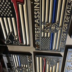 four metal plaques with american flags on them