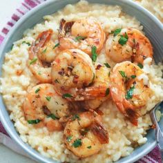 two bowls filled with rice and shrimp on top of each other