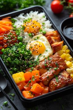 a meal in a plastic container with rice, meat and vegetables