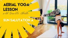 a woman is doing yoga in her living room