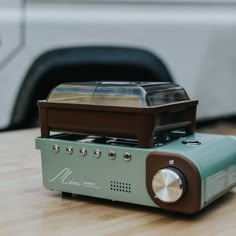 an old radio sitting on top of a wooden table