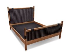 a wooden bed frame with slatted headboard and foot board on the side