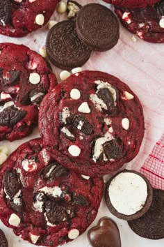 chocolate cookies and oreos with white chocolates on the side, next to each other