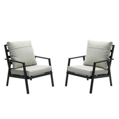 two black and white chairs sitting next to each other