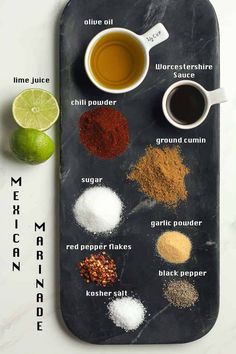 the ingredients to make mexican limeade on a cutting board with measuring spoons and spices