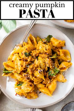 creamy pumpkin pasta on a white plate with a black and white text overlay that reads, creamy pumpkin pasta